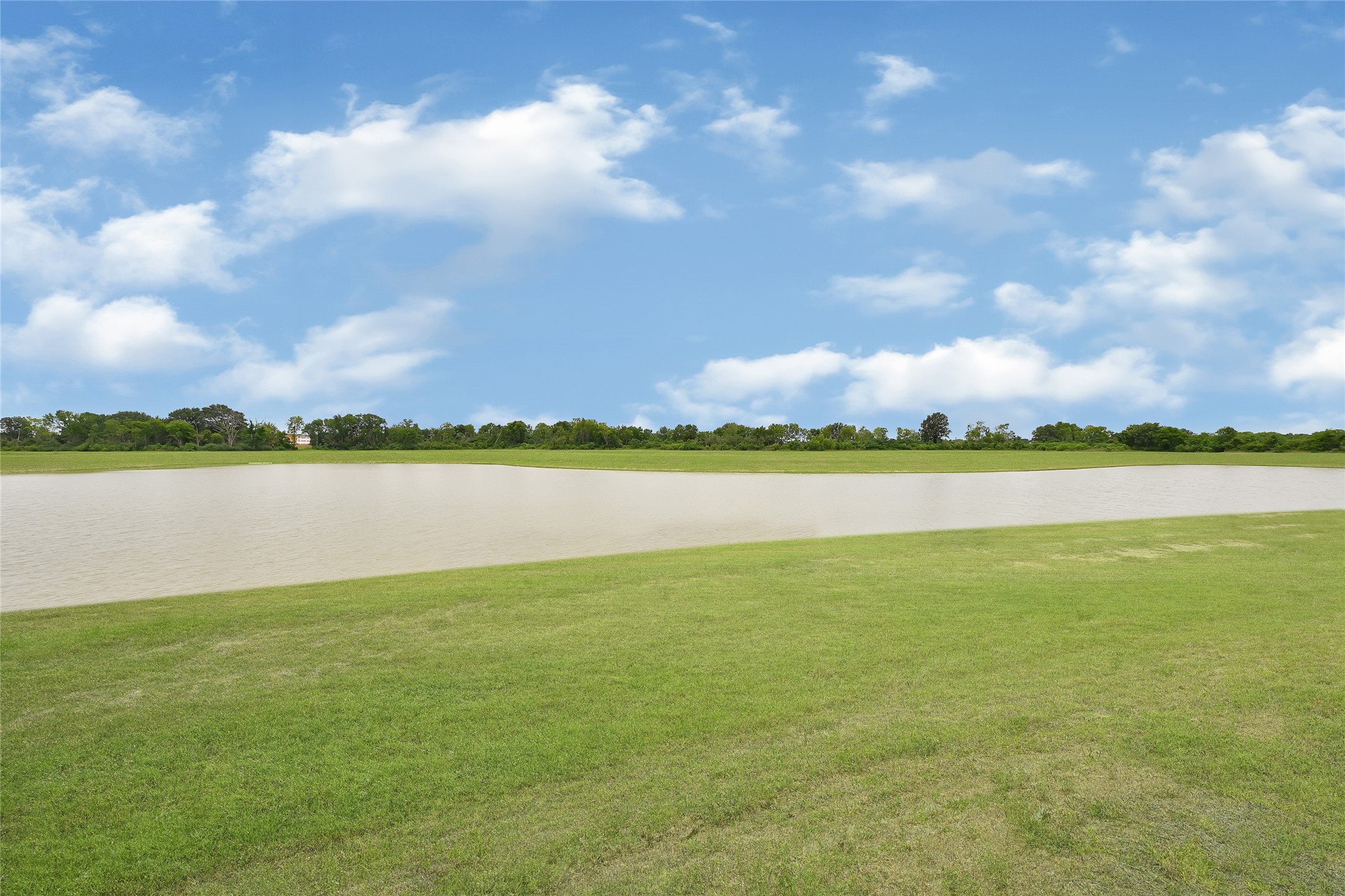5702 Transformation Trail Katy, TX 77493 - Photo 5 of 32 a view of a lake with houses in the background