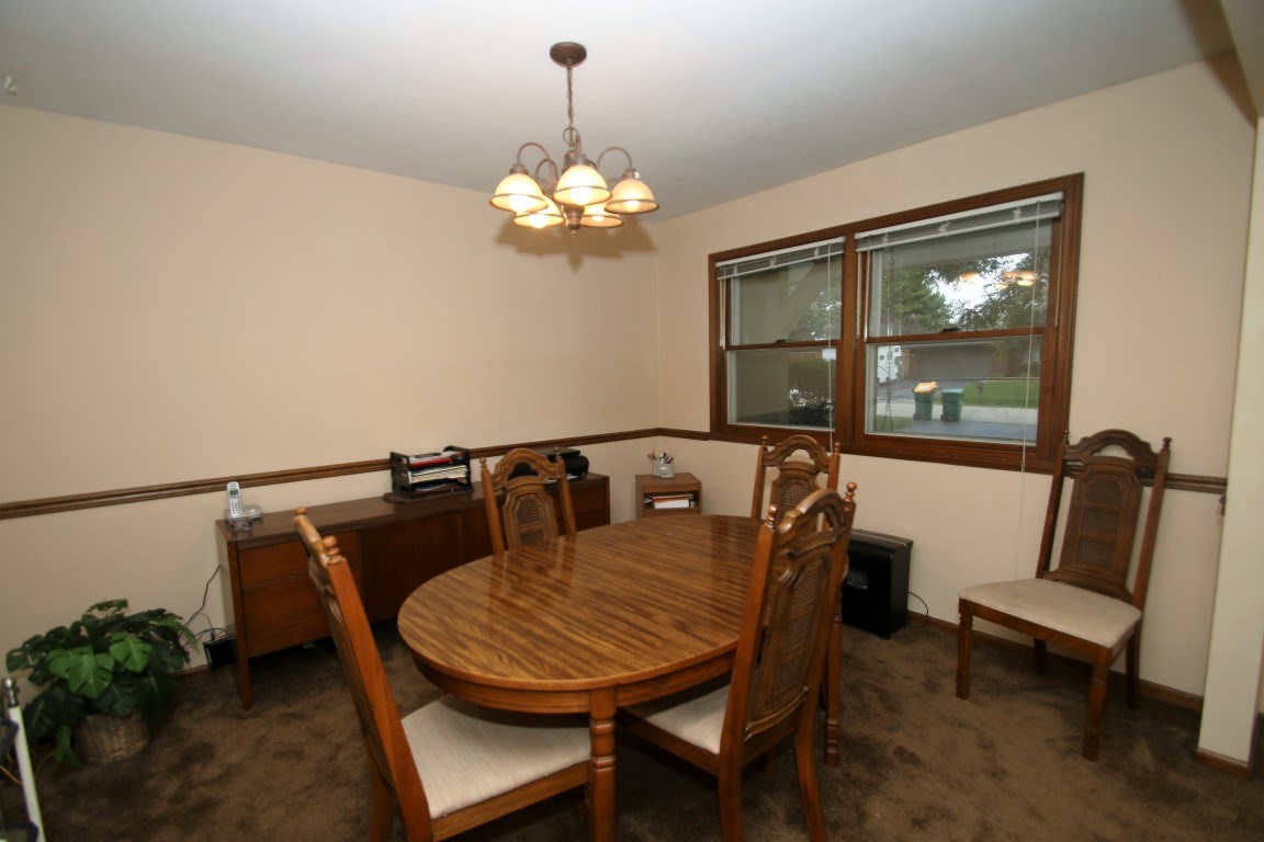 8131 Clockview Road Rockford, IL 61108 - Photo 6 of 25 a view of a dining room with furniture window and outside view