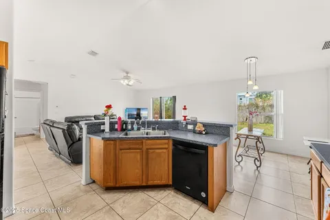 a kitchen with a sink and a stove