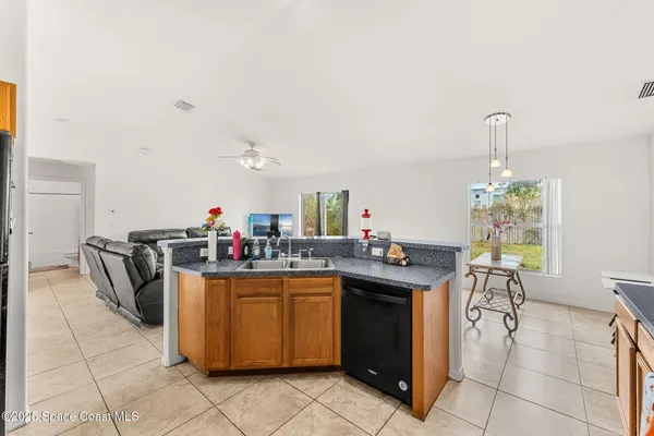a kitchen with a sink and a stove