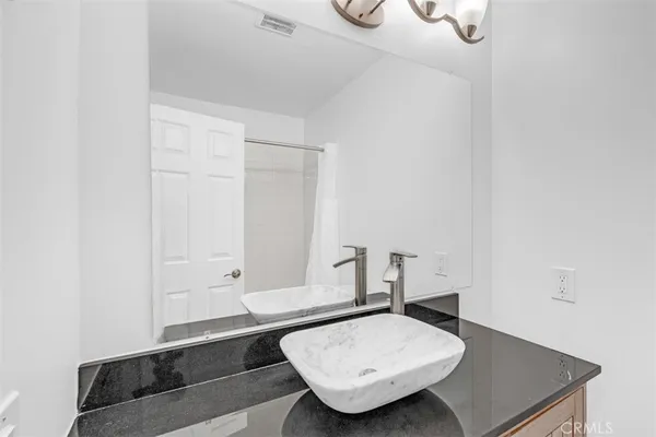 a bathroom with a sink and tub