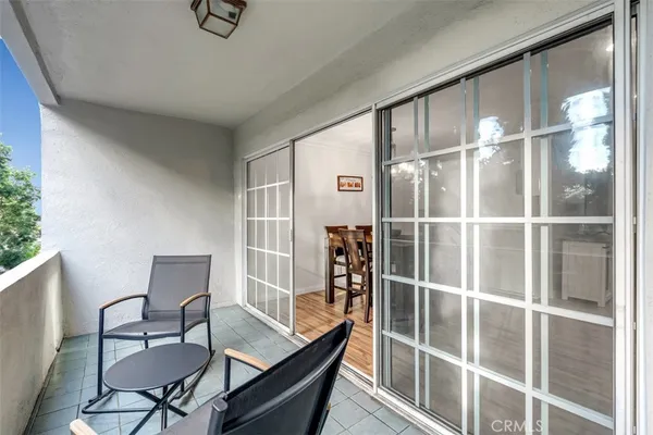 a view of a livingroom with furniture and a window