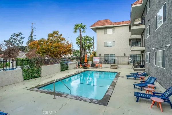 a view of a swimming pool with chairs