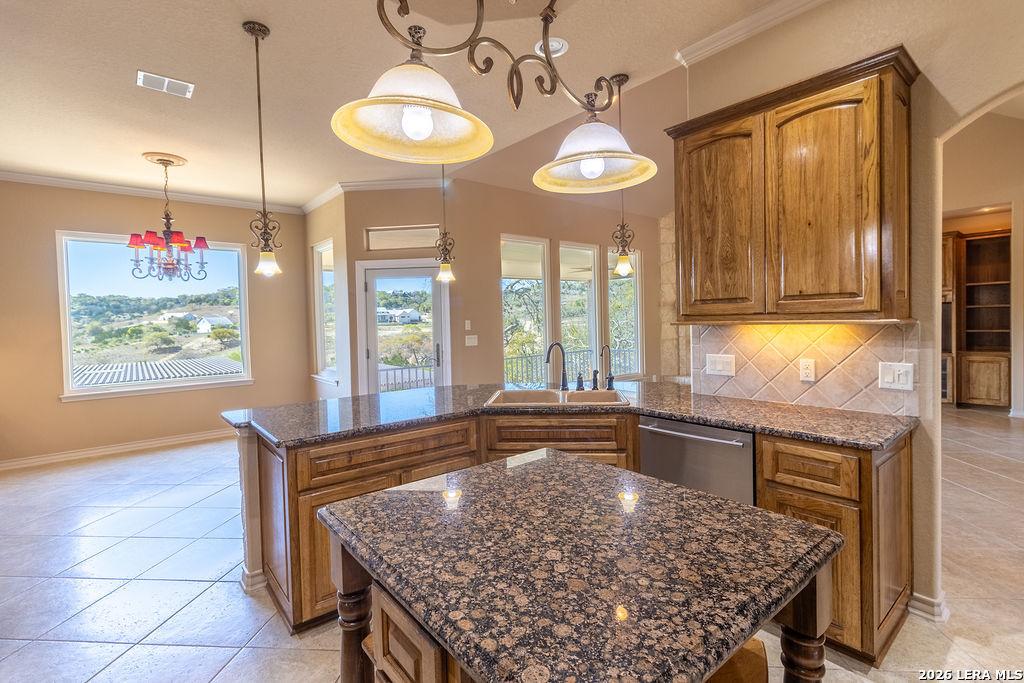 198 Echo Falls Road Comfort, TX 78013 - Photo 4 of 28 a kitchen with stainless steel appliances granite countertop a stove a sink and a microwave