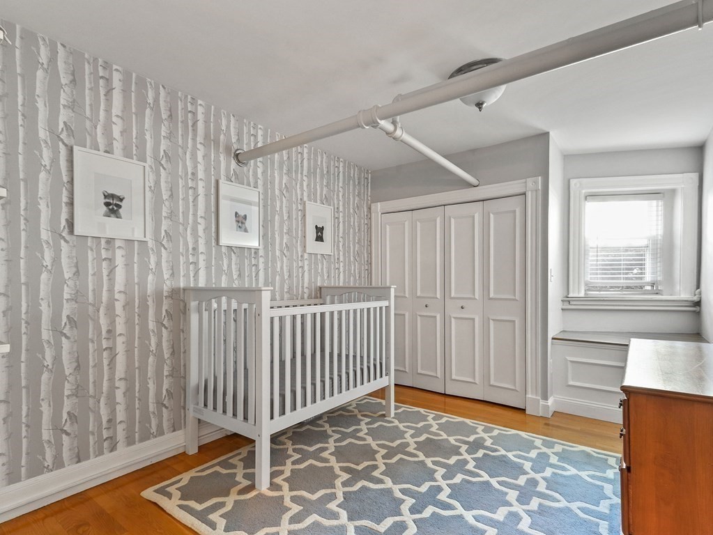 16 Garrison Road, Unit 8 Brookline, MA 02445 - Photo 11 of 20 a view of a room with wooden floor & a window