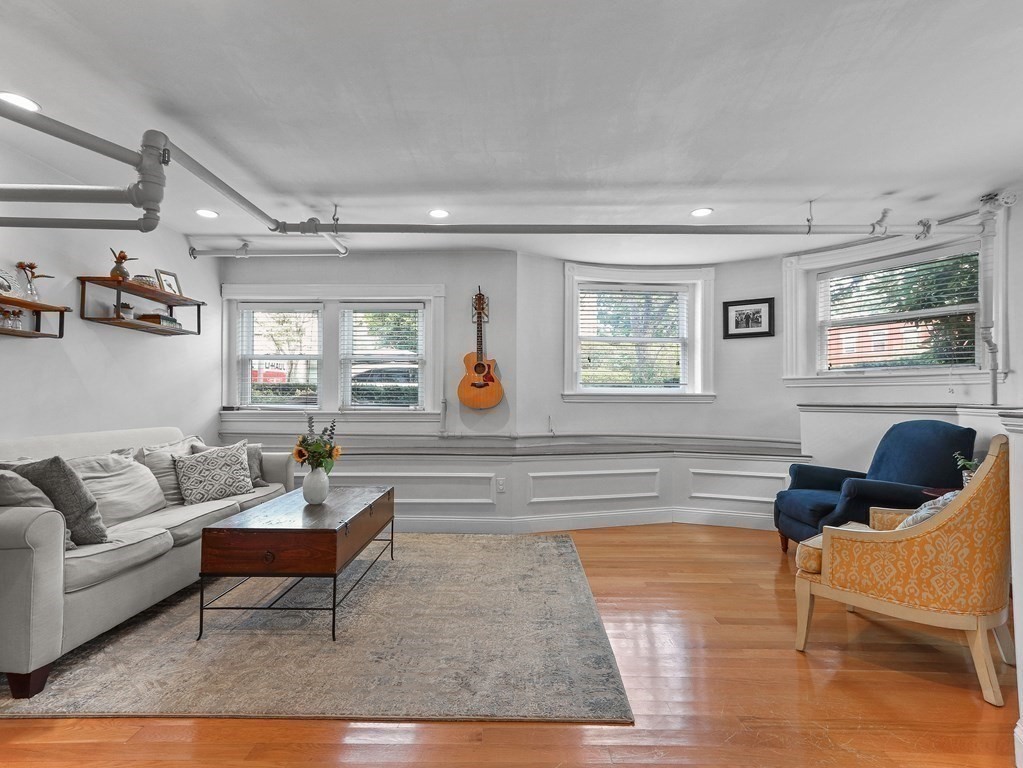 16 Garrison Road, Unit 8 Brookline, MA 02445 - Photo 2 of 20 a living room with furniture kitchen view and a window