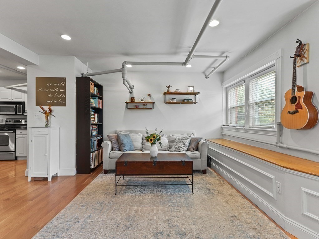 16 Garrison Road, Unit 8 Brookline, MA 02445 - Photo 4 of 20 a living room with furniture and a window