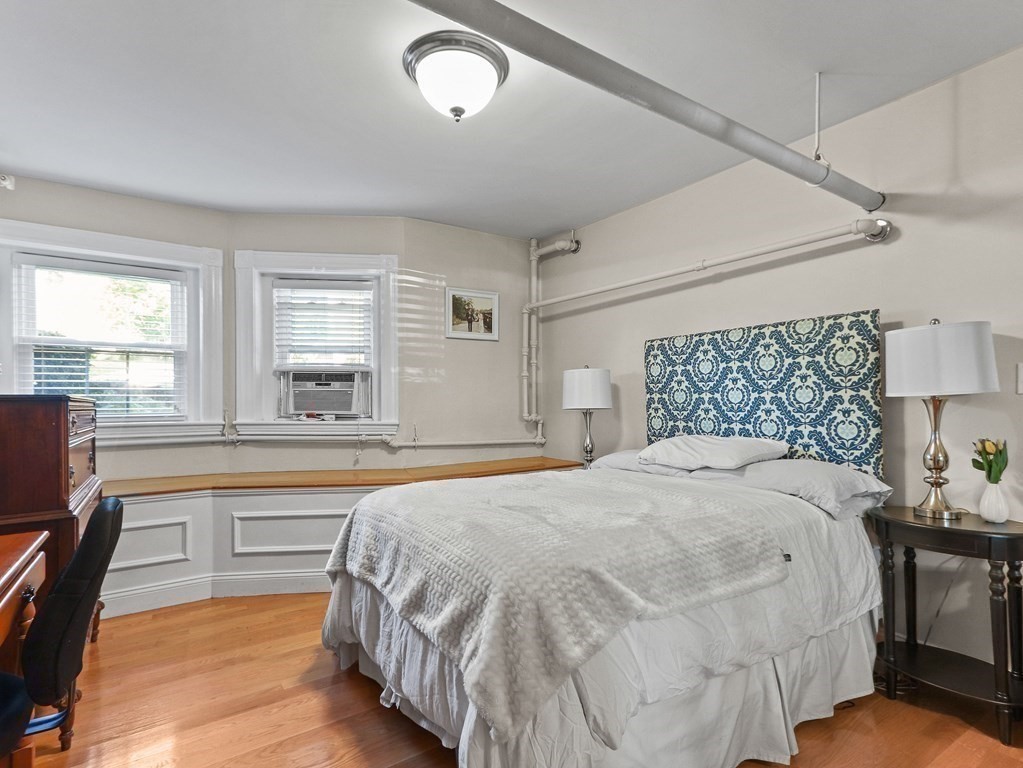 16 Garrison Road, Unit 8 Brookline, MA 02445 - Photo 10 of 20 a bedroom with a large bed and a window