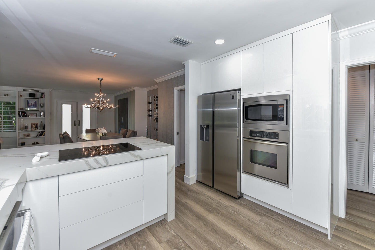 880 Hickory Terrace Boca Raton, FL 33486 - Photo 8 of 38 a kitchen with kitchen island stainless steel appliances a refrigerator stove and oven