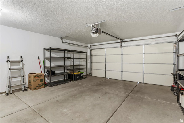 2028 West Grace Way Layton, UT 84041 - Photo 27 of 36 Garage with a garage door opener