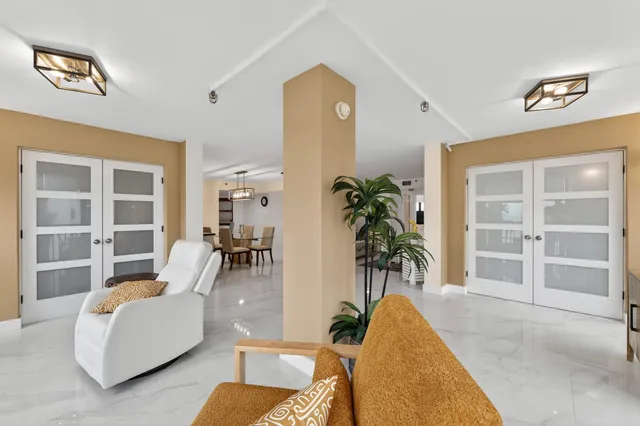 a living room with furniture and white walls