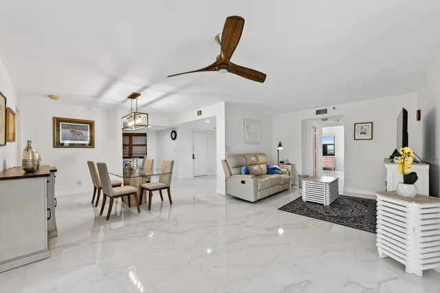 a kitchen with stainless steel appliances granite countertop a refrigerator a stove top oven a sink and dishwasher