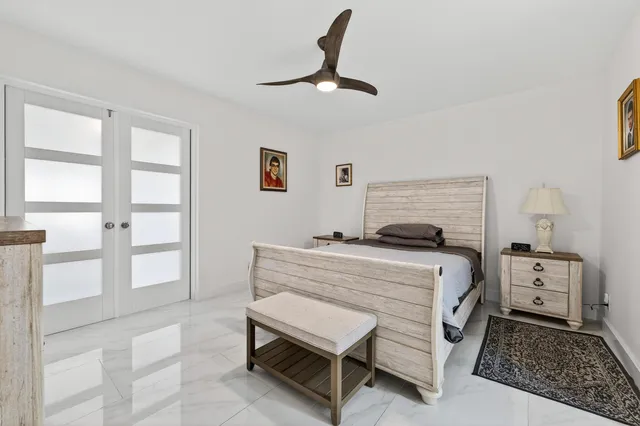 a bedroom with a bed and a table