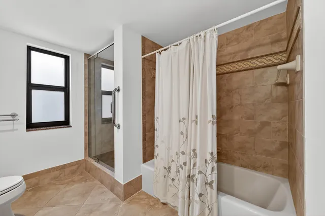 a living room with furniture and white walls