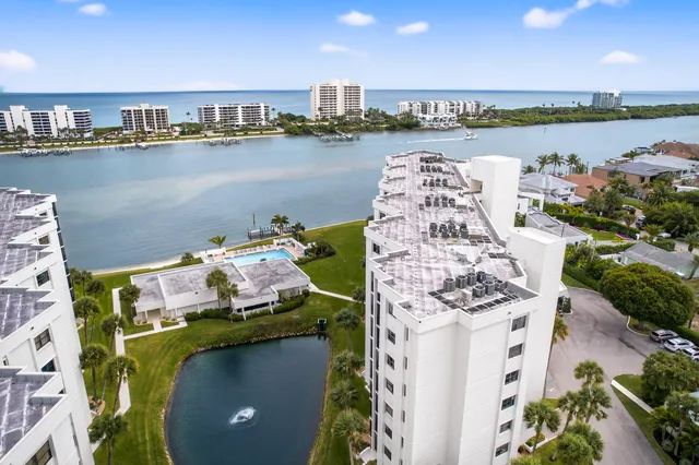 an aerial view of multiple houses with yard