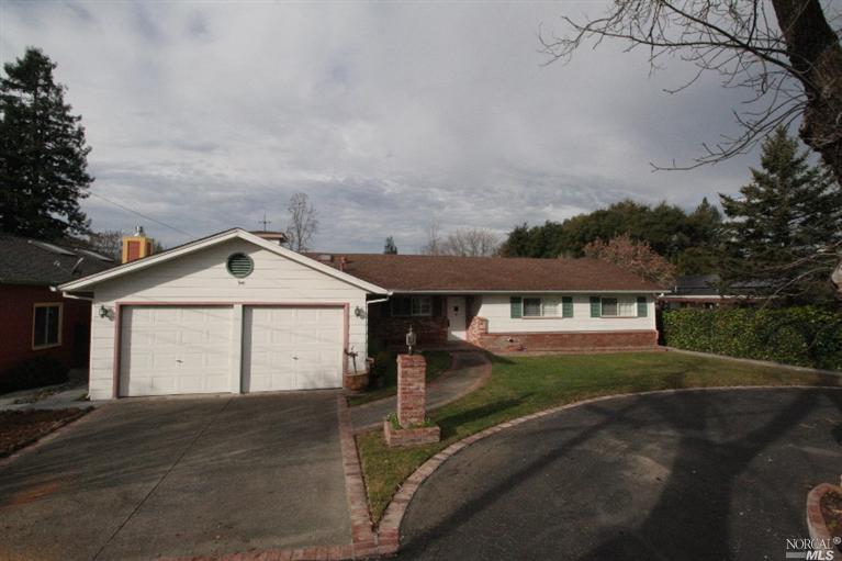 211 Ursuline Road Santa Rosa, CA 95403 - Photo 1 of 1 a front view of a house with a yard and garage
