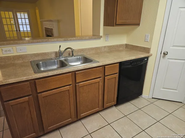 a kitchen with a sink and cabinets