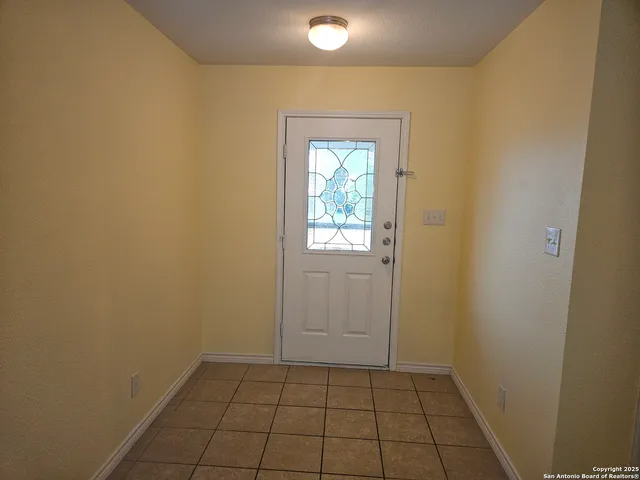 a view of an empty room and window