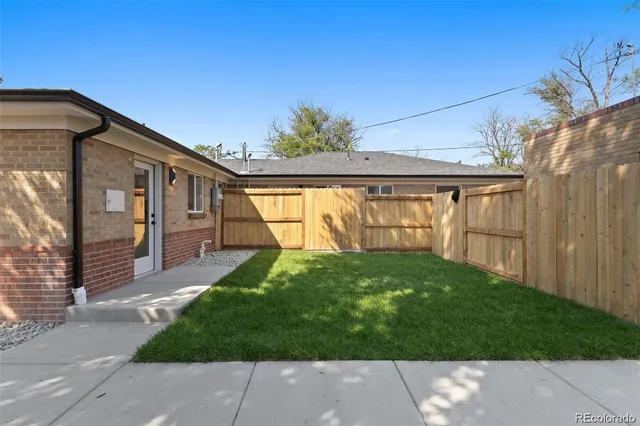 a view of backyard with a garden and plants