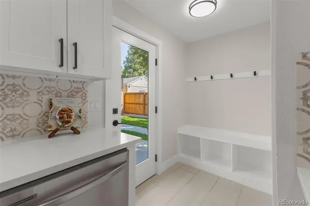 a view of a livingroom with wooden floor and a large window