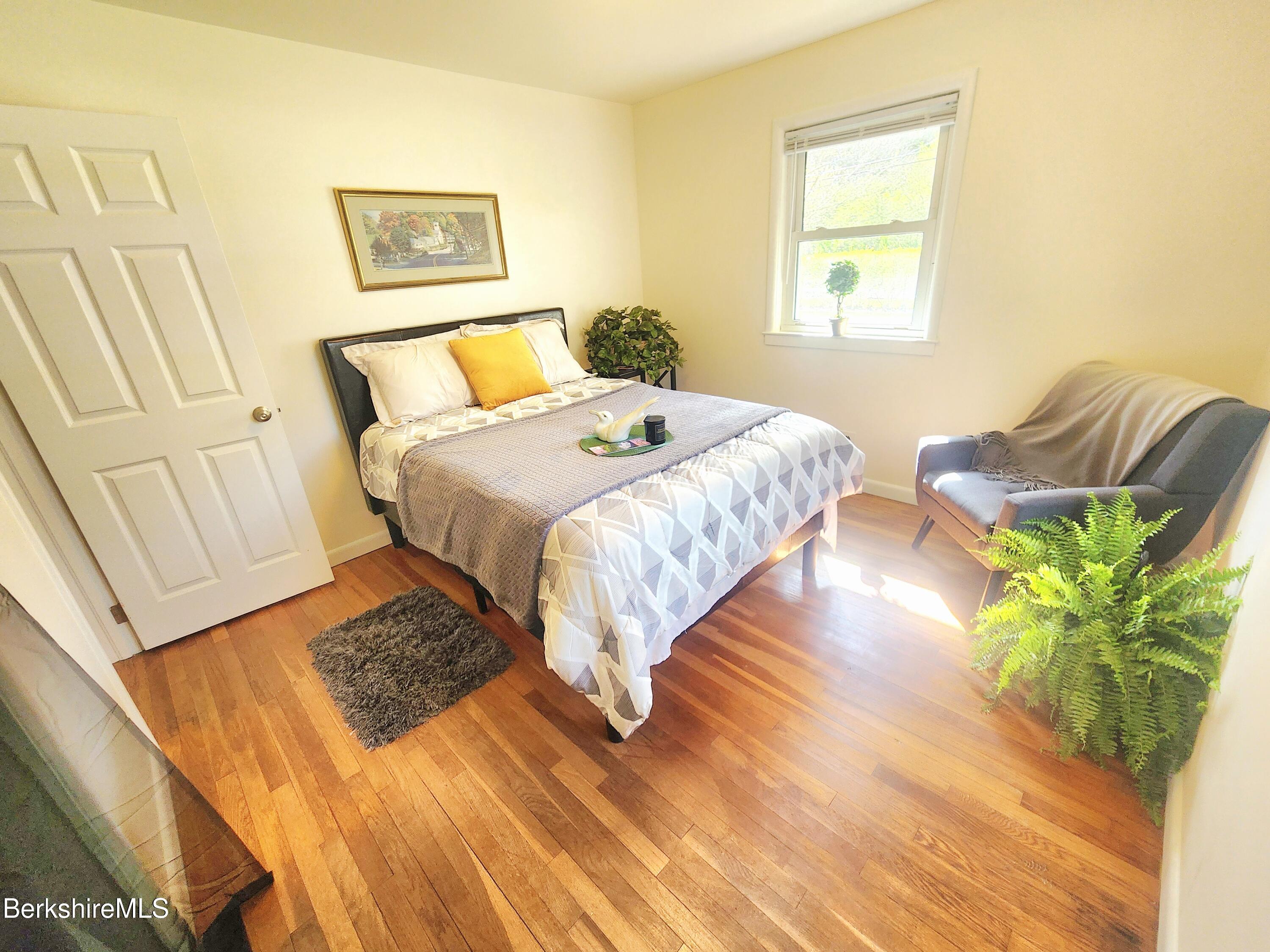 16 East New Lenox Road Lenox, MA 01240 - Photo 13 of 31 a bedroom with a bed and a couch