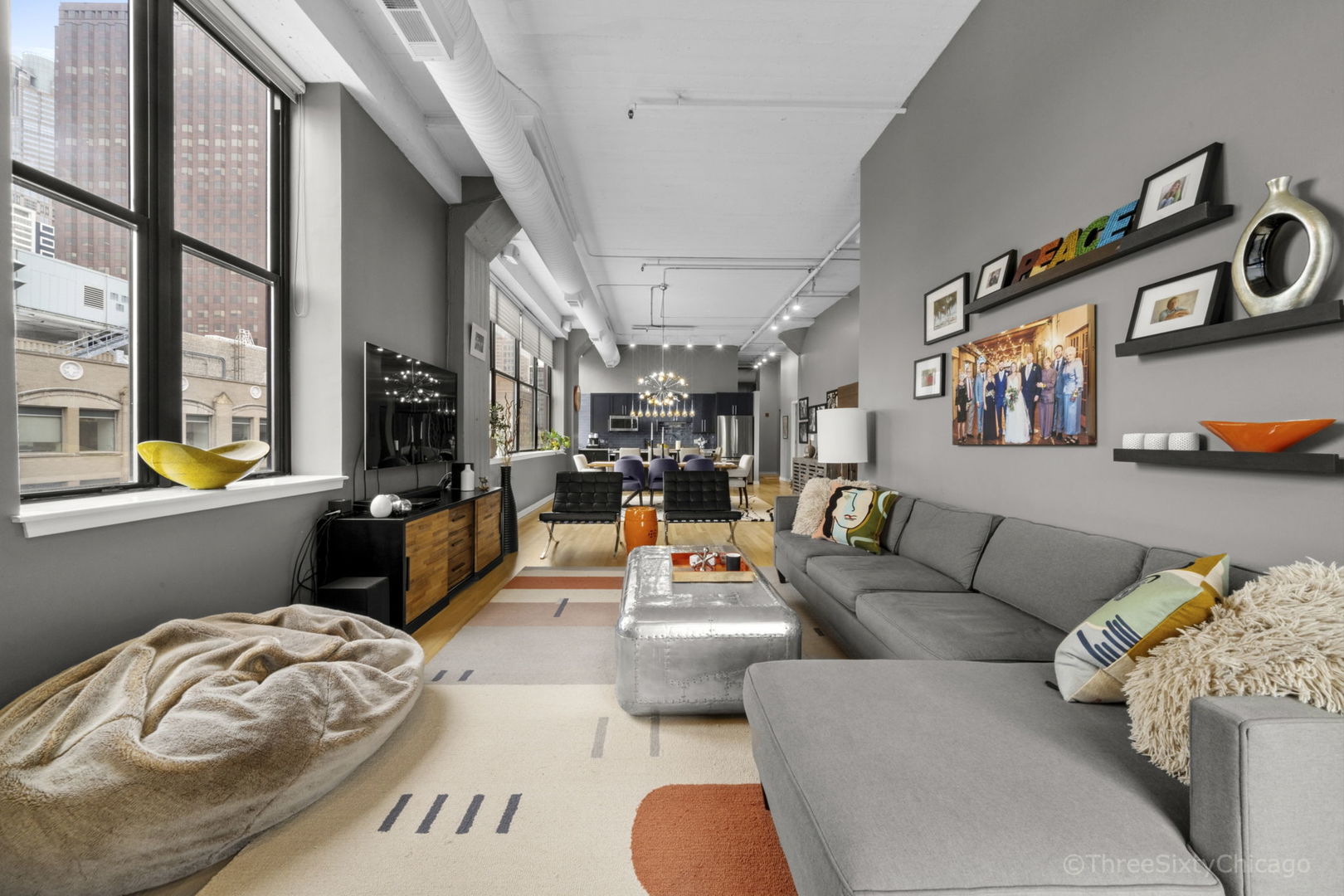 547 South Clark Street, Unit 1002 Chicago, IL 60605 - Photo 12 of 26 a living room with furniture fireplace and a large window