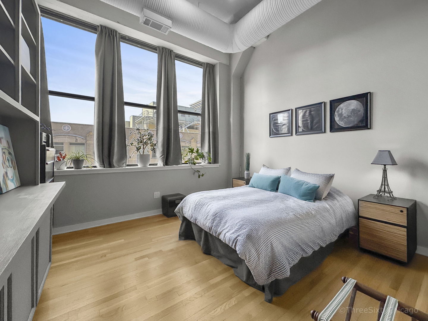 547 South Clark Street, Unit 1002 Chicago, IL 60605 - Photo 20 of 26 a bedroom with a bed and glass window