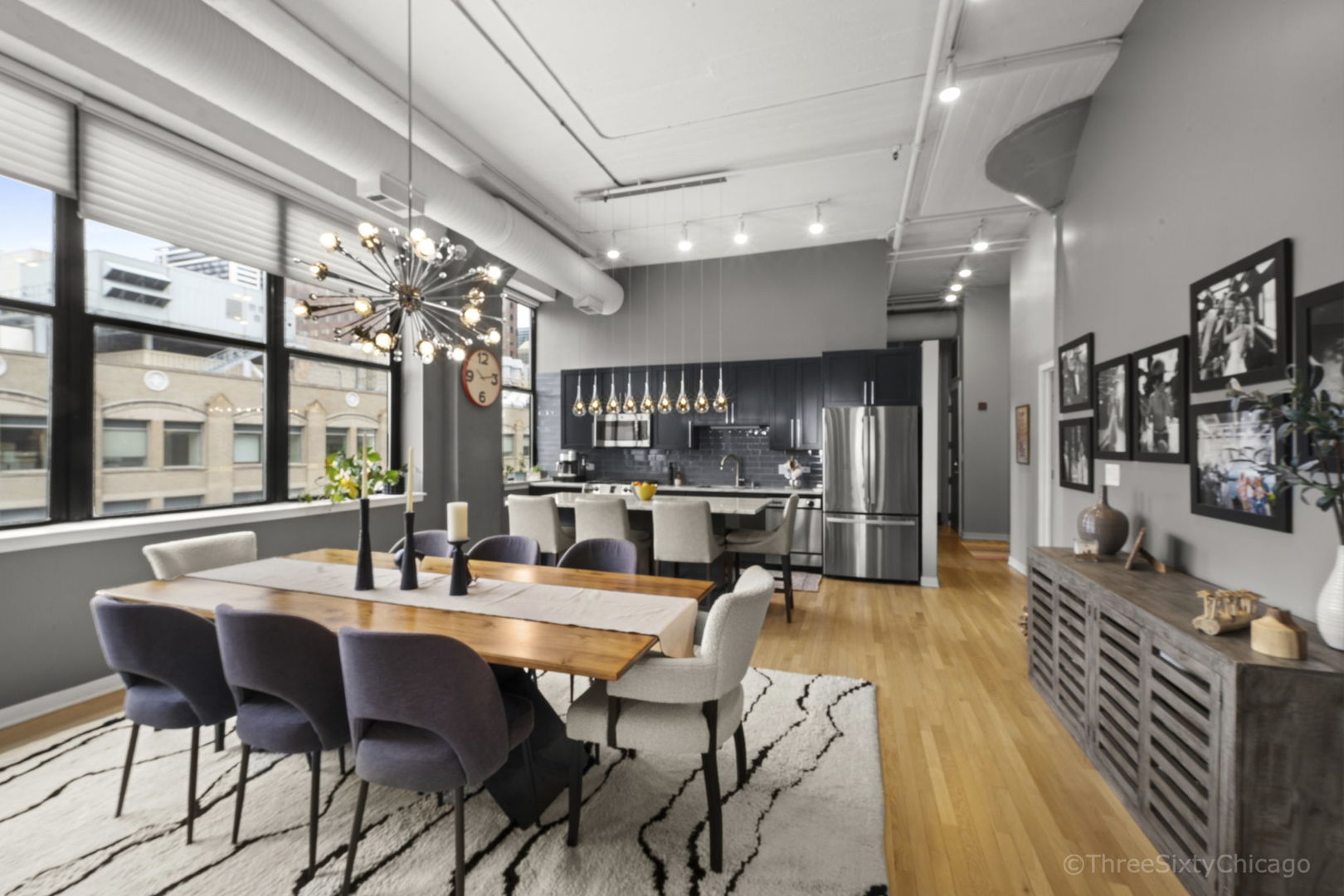 547 South Clark Street, Unit 1002 Chicago, IL 60605 - Photo 4 of 26 a view of a dining room with furniture window and wooden floor