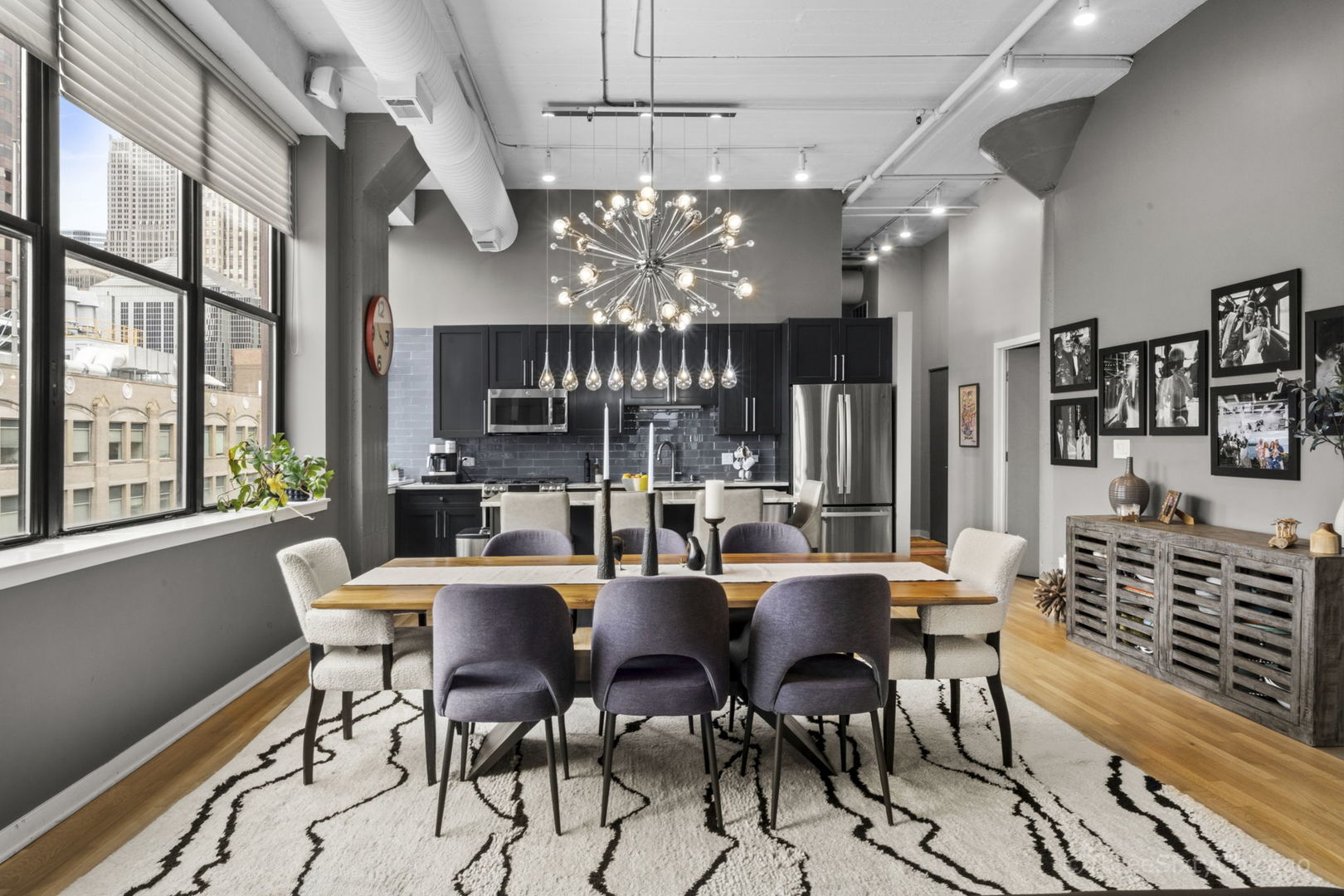 547 South Clark Street, Unit 1002 Chicago, IL 60605 - Photo 5 of 26 a view of a dining room with furniture a chandelier and window