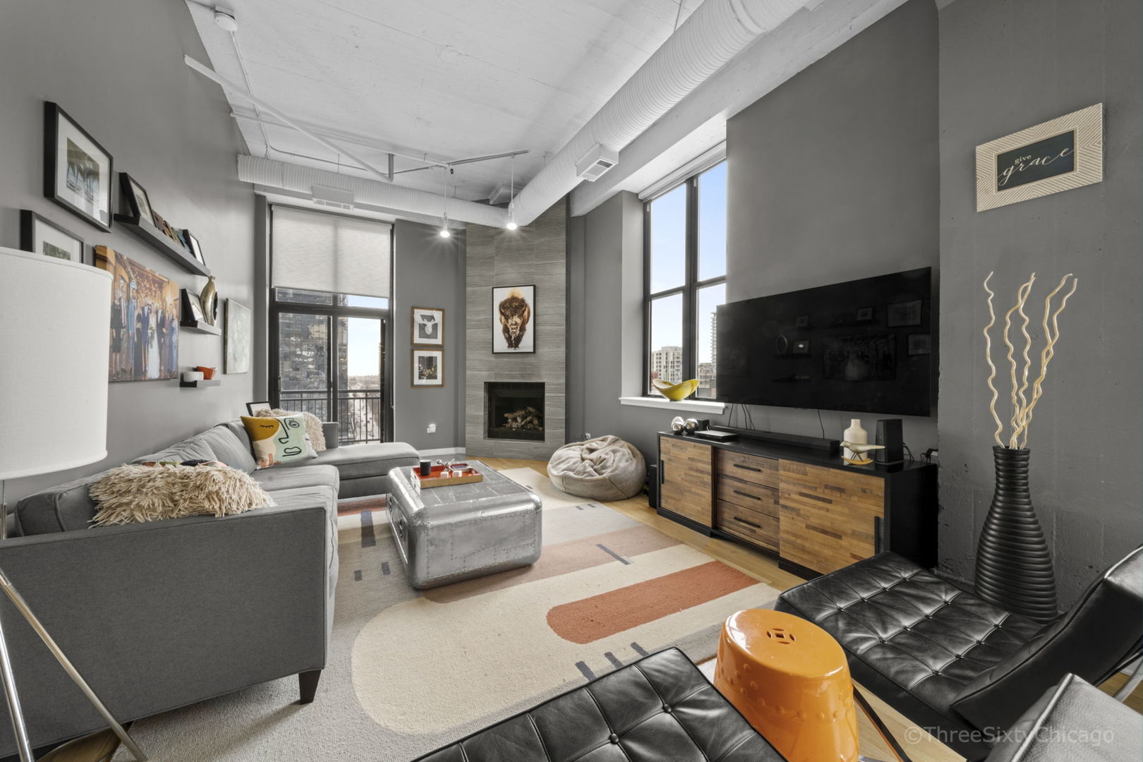 547 South Clark Street, Unit 1002 Chicago, IL 60605 - Photo 8 of 26 a living room with furniture and a flat screen tv