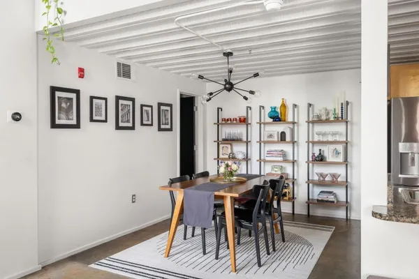 a dining room with furniture and window