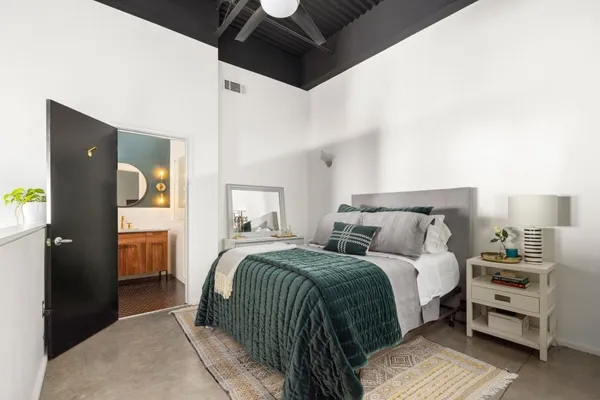 a bedroom with a bed and a walk in closet