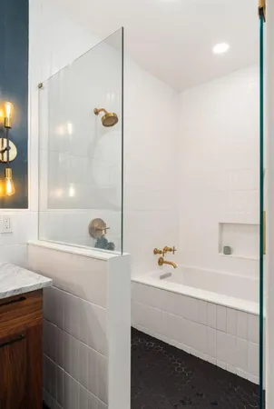 a bathroom with a bathtub and a sink
