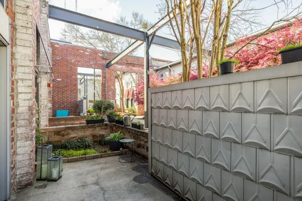 a view of a bench sitting in backyard of a house