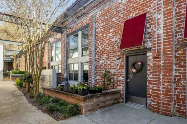 a view of a brick building with many windows
