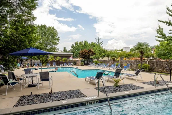 a view of a swimming pool with chairs
