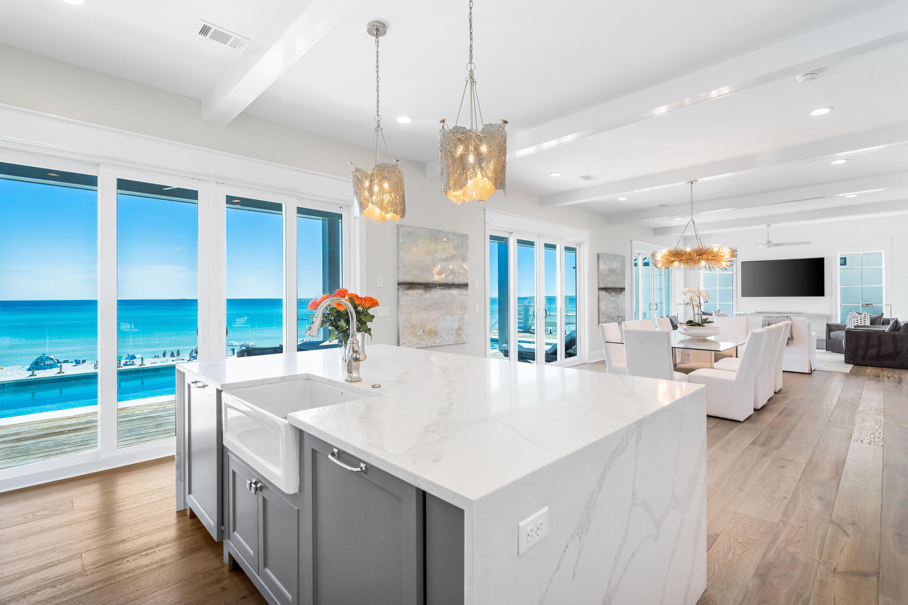25 Fort Panic Road Santa Rosa Beach, FL 32459 - Photo 2 of 88 a large kitchen with kitchen island a large counter top space a sink appliances and living room view