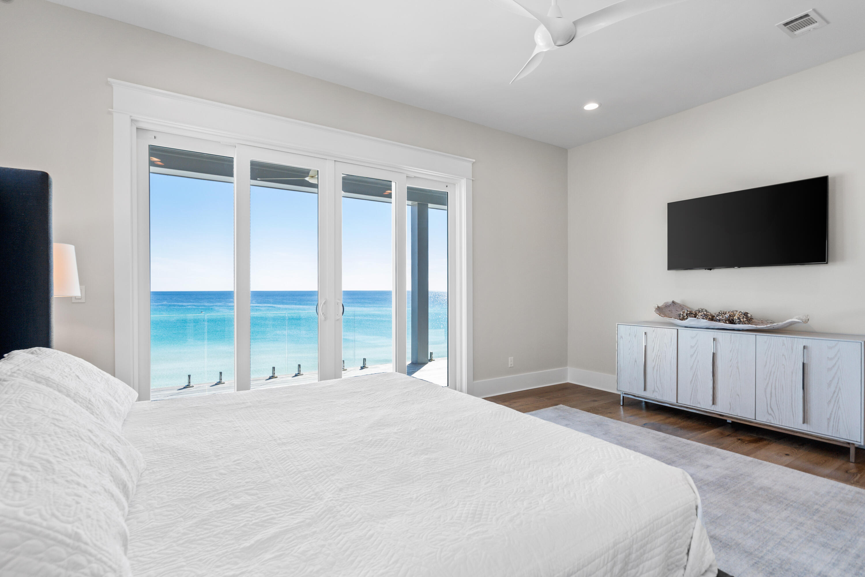 25 Fort Panic Road Santa Rosa Beach, FL 32459 - Photo 33 of 88 a bedroom with a large window and a flat screen tv