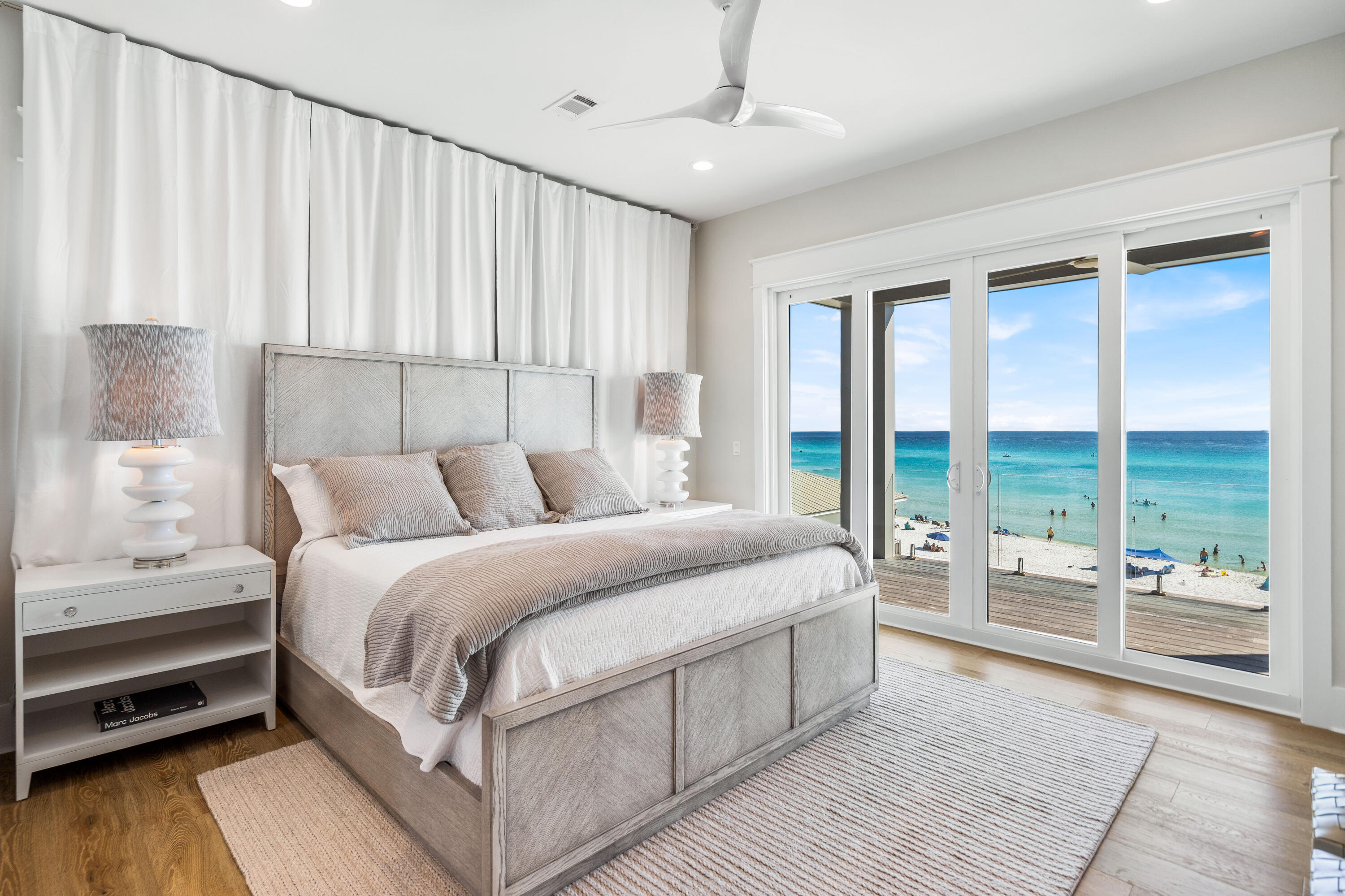 25 Fort Panic Road Santa Rosa Beach, FL 32459 - Photo 37 of 88 a bedroom with a large bed and a balcony view