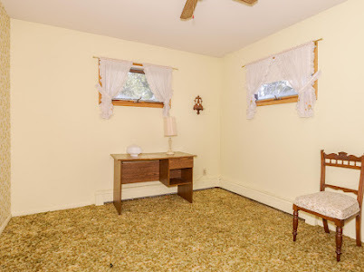 23641 North 100 E Road Flanagan, IL 61740 - Photo 16 of 30 a room with painting on the wall and a table