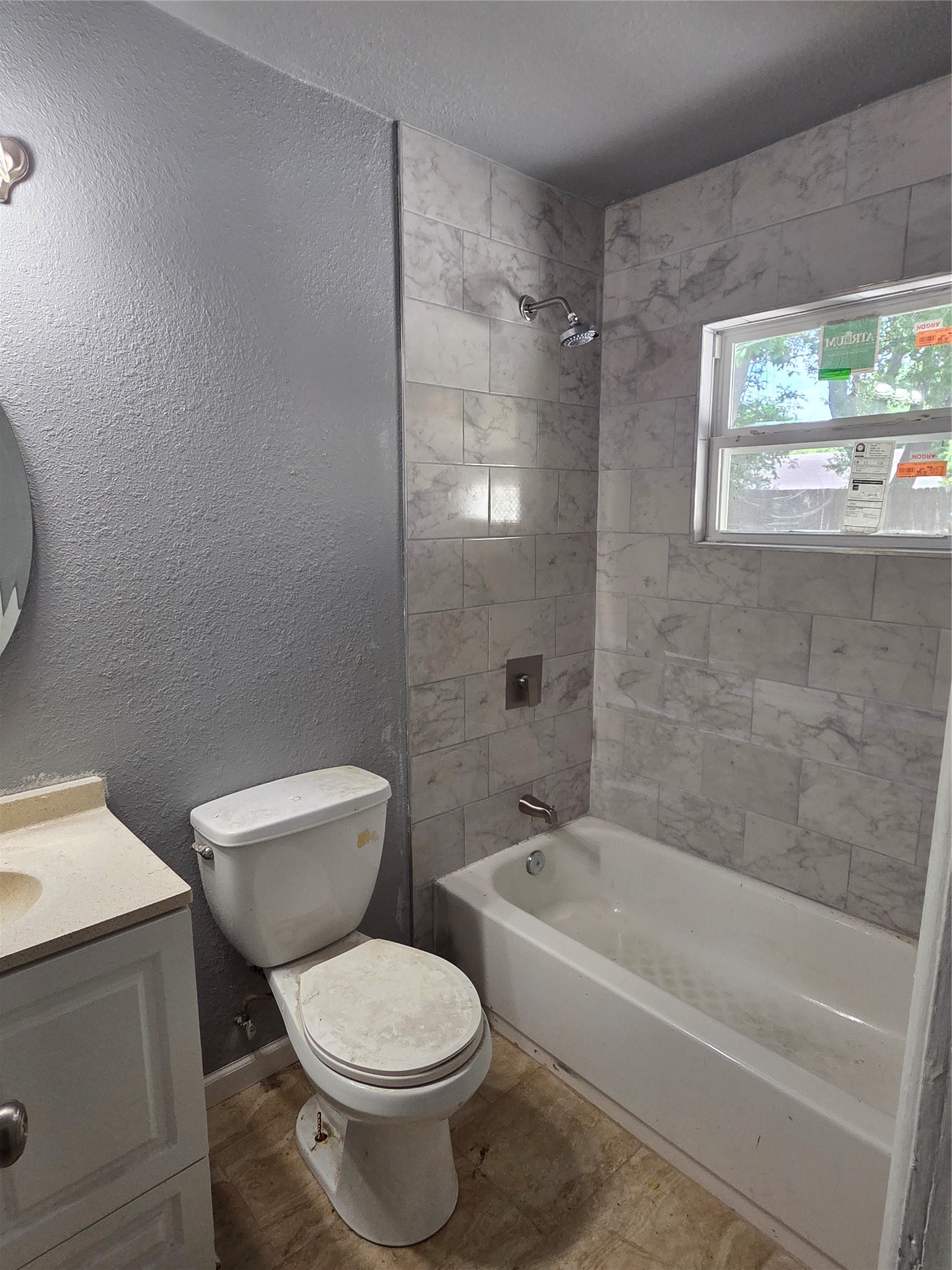 4933 Alvin Street Houston, TX 77033 - Photo 9 of 9 a white toilet sitting next to a bath tub