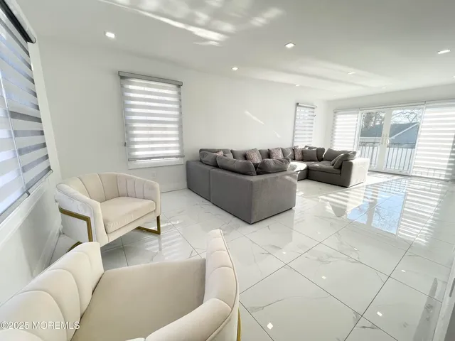 a living room with furniture and a couch