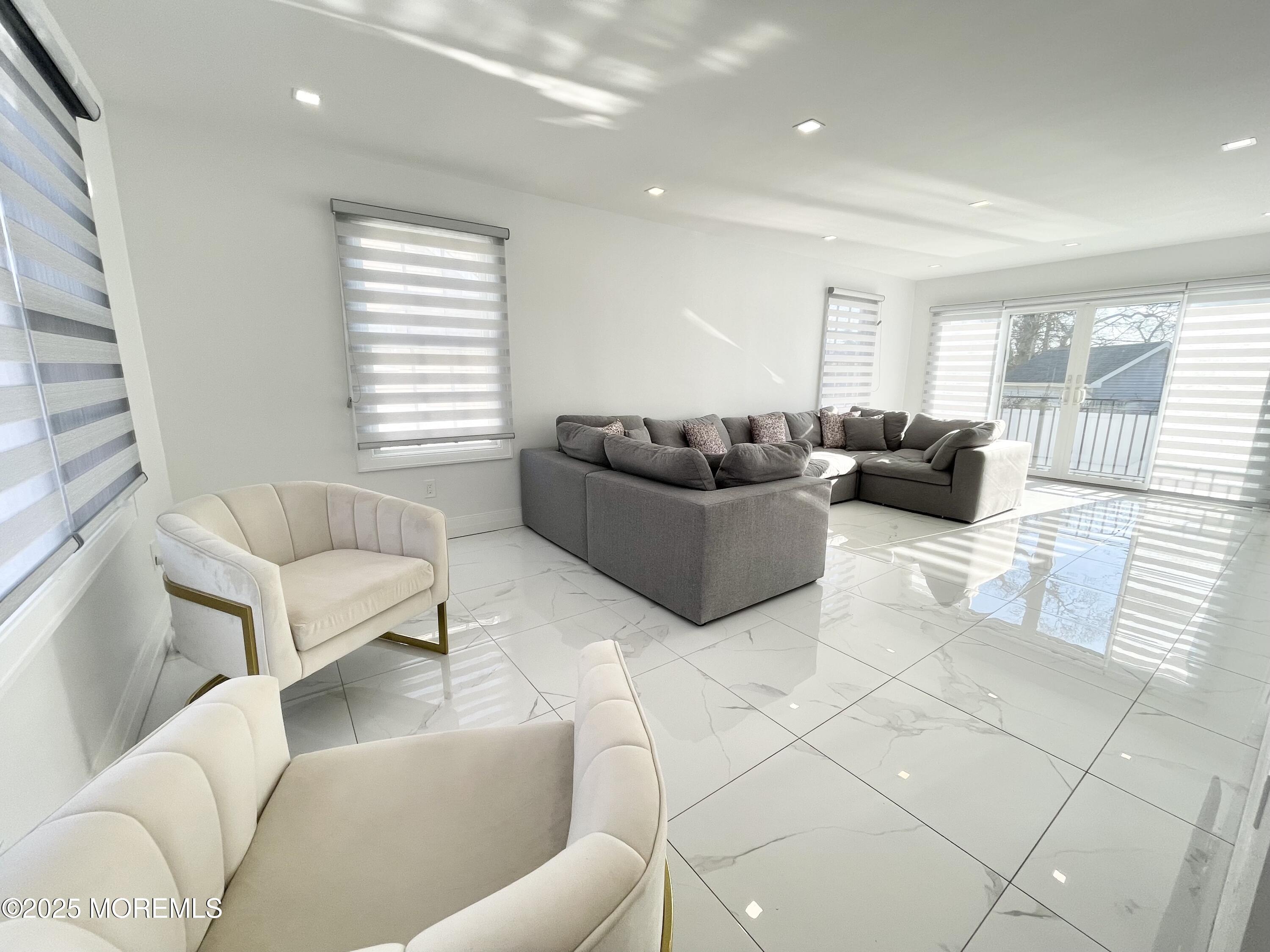 7 Berger Avenue Oakhurst, NJ 07755 - Photo 1 of 14 a living room with furniture and a couch