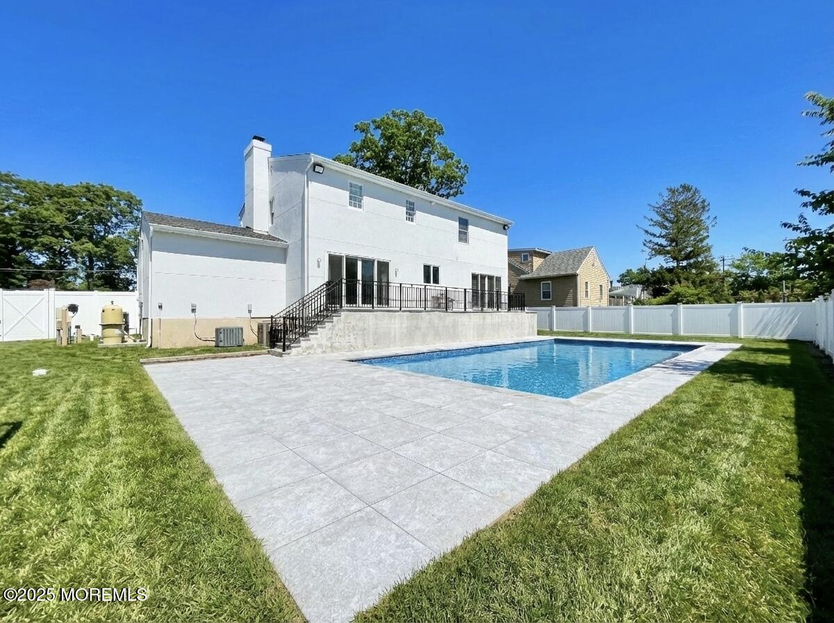 7 Berger Avenue Oakhurst, NJ 07755 - Photo 13 of 14 a view of a backyard patio and fire pit