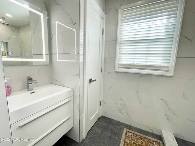 a bathroom with a sink and a bathtub