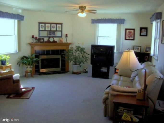 9526 North Laurel Road Laurel, MD 20723 - Photo 4 of 16 Cozy room with gas fireplace