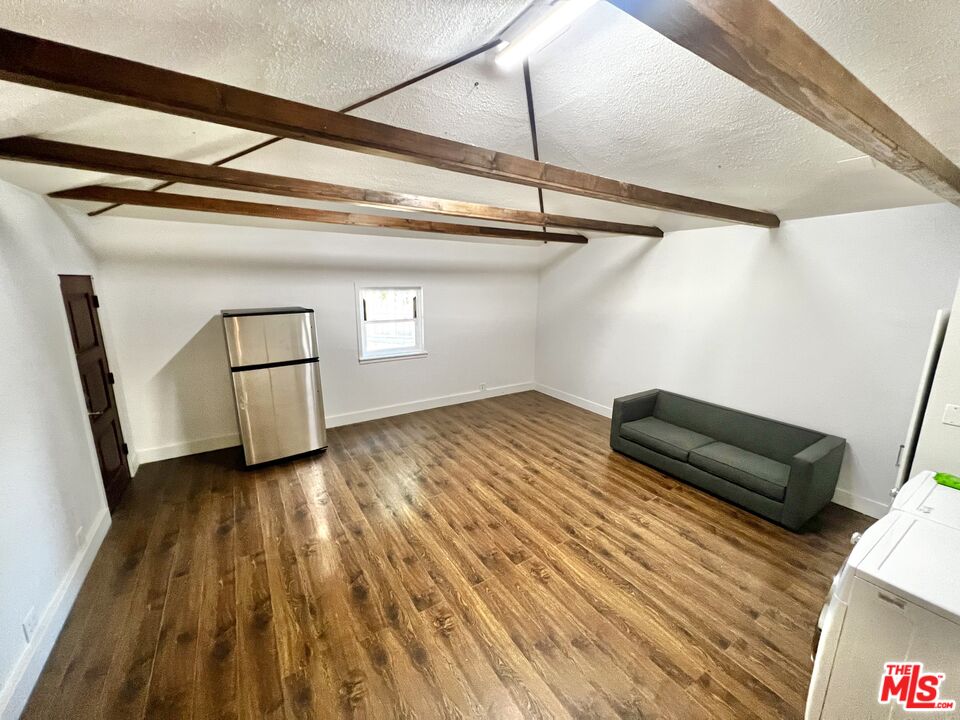 5757 Vesper Avenue Van Nuys, CA 91411 - Photo 16 of 26 a view of a room with wooden floor and white walls
