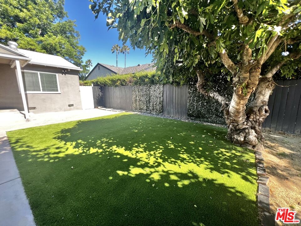 5757 Vesper Avenue Van Nuys, CA 91411 - Photo 18 of 26 a view of a house with a backyard