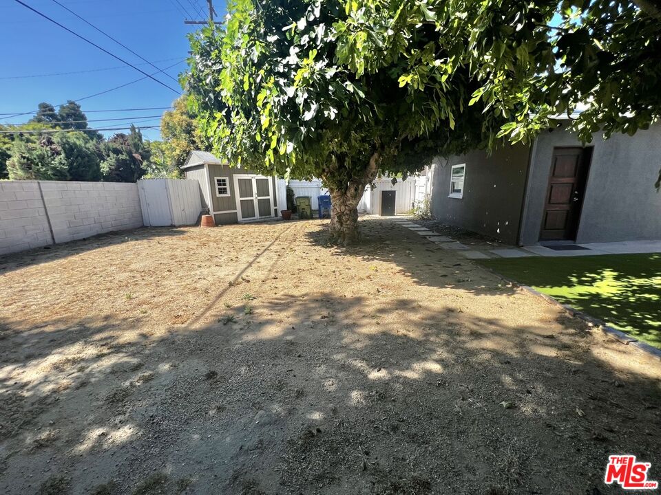 5757 Vesper Avenue Van Nuys, CA 91411 - Photo 20 of 26 a front view of a house with a yard