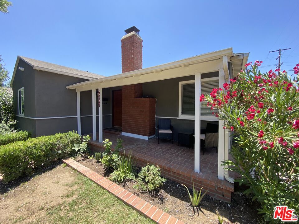 5757 Vesper Avenue Van Nuys, CA 91411 - Photo 2 of 26 a front view of a house with a porch
